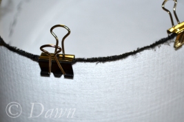 Close up of the binder clips used to 'pin' the Wellington band to the Pillbox band
