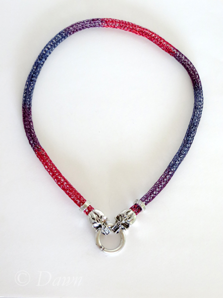 Red, purple, and blue Viking Knit with skull end caps and a spring gate clasp. 