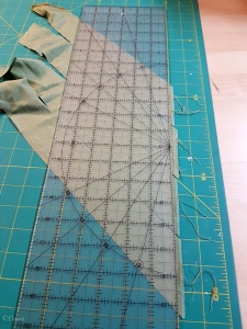 Trimming bias strips for binding the bodice out of matcha-green silk broadcloth