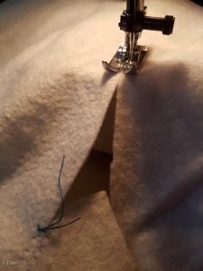 Using a zig zag stitch to sew the batting with a butted seam.