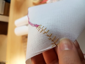 A hand-stitched butted seam on buckram for my horned hennin.