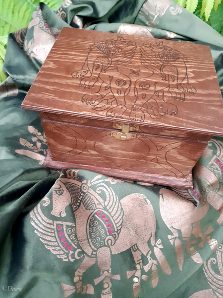 The top of this wood burned box was based on a 11th century textile. 