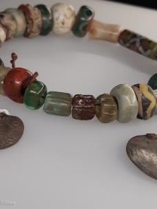 Beads and coins from a Viking Age woman's grave.