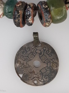 Beads and a pendant  from a Viking Age woman's grave. 
